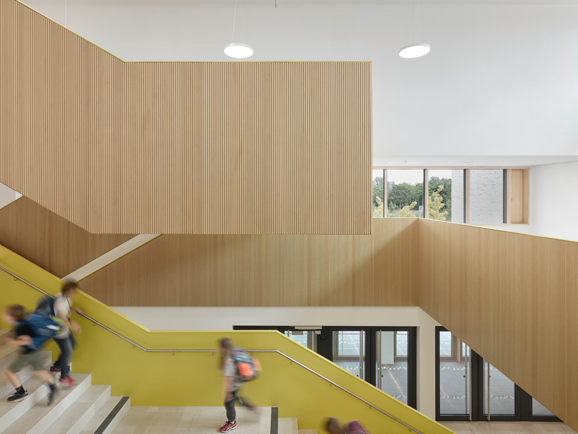 Silver fir proline acoustic panels lining the stair hall of the Emanuel School, Cologne